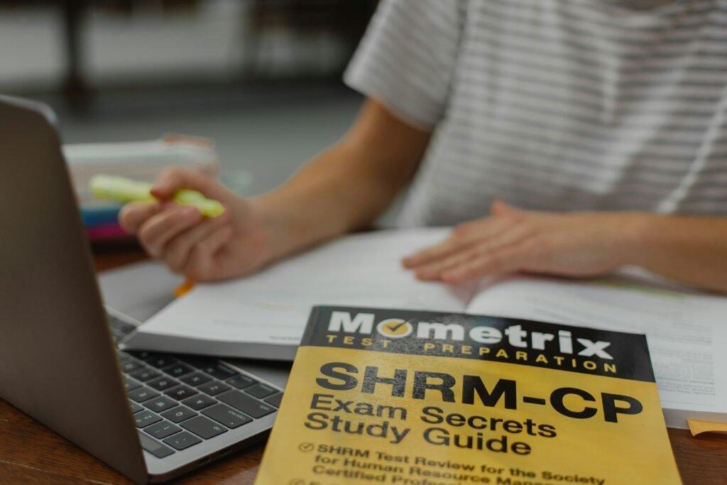 student with study guide - How To Study For A Final Exam