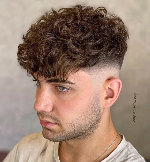 Picture showing a guy rocking the curly french crop