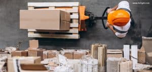 man moving a single box on trolley