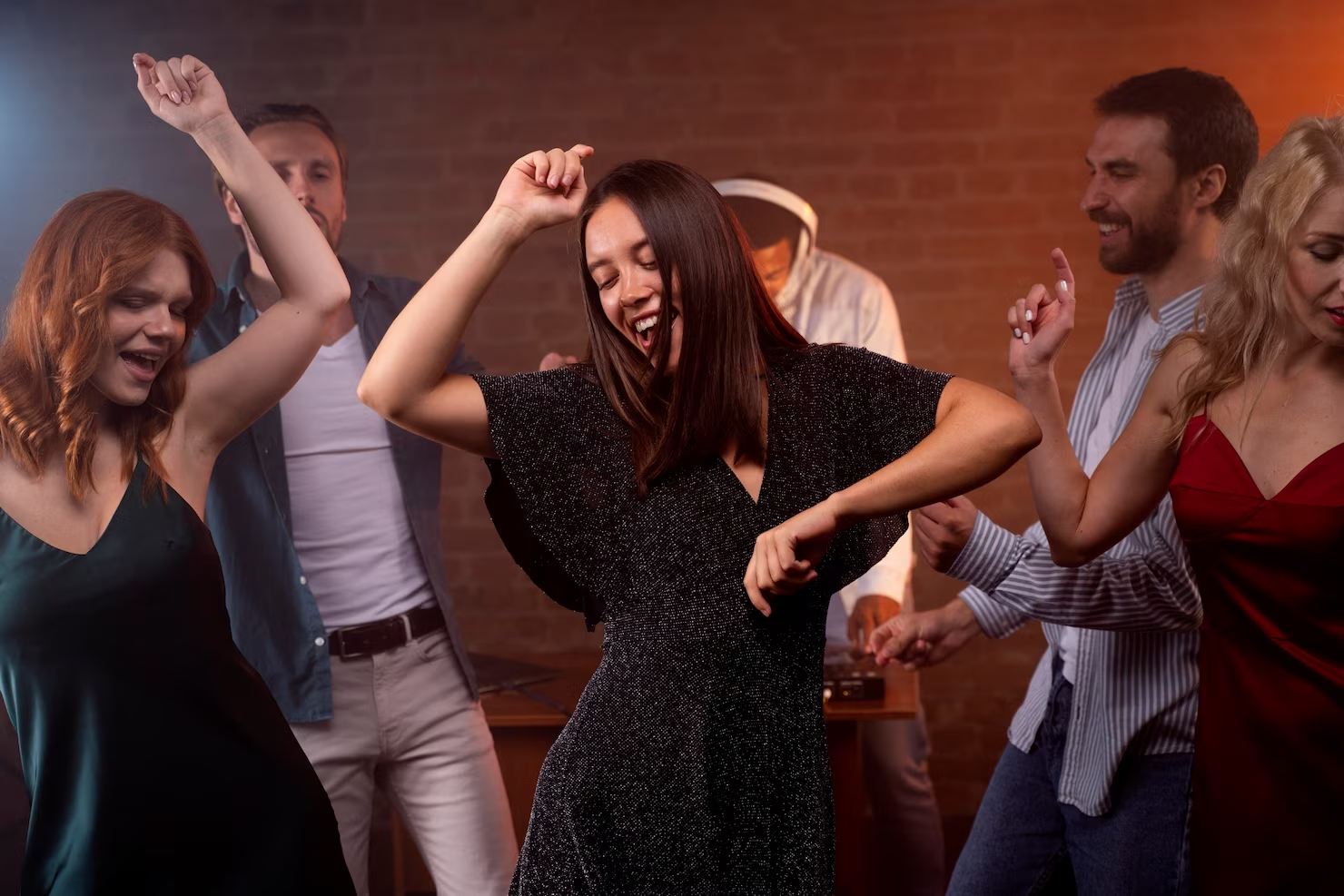 People dancing and having fun together on a night out.
