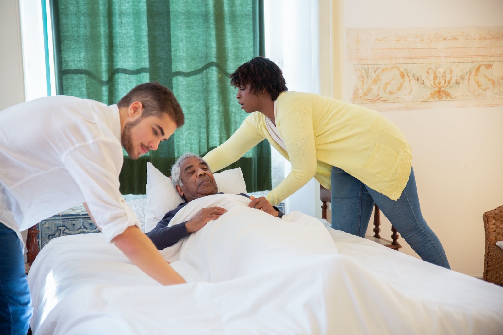 An in-home nurse working with patient.