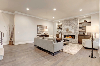 ways to prepare your basement space for hosting comfortable flooring with sofas and fireplace custom built michigan