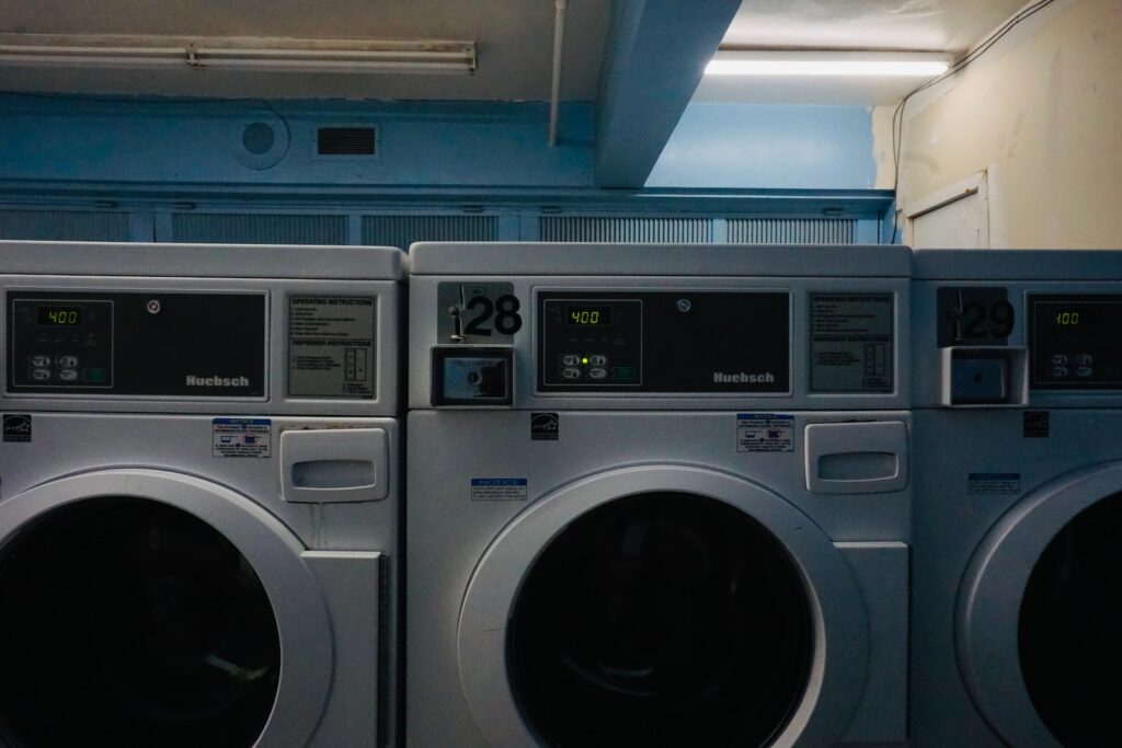 a row of washing machines sitting next to each other
