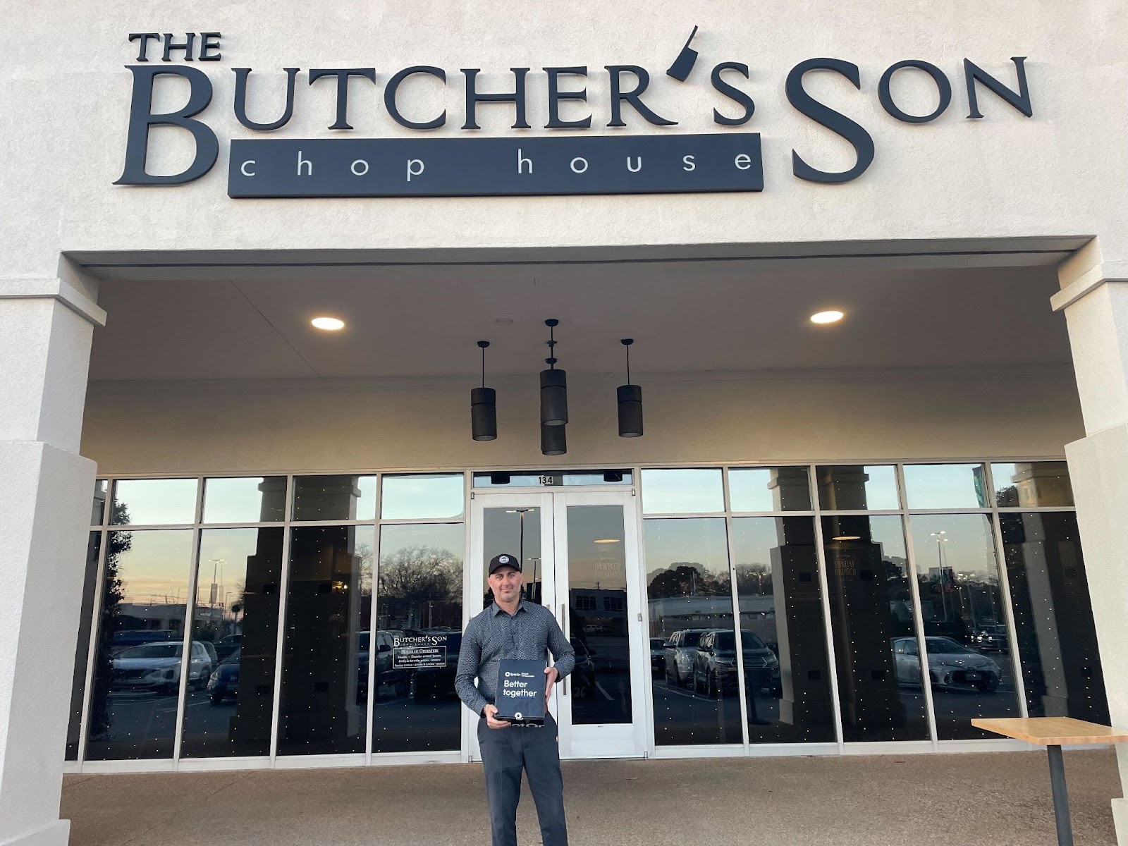 The Butcher's Son restaurant pos point of sale system restaurant operation owner posing with the restaurant