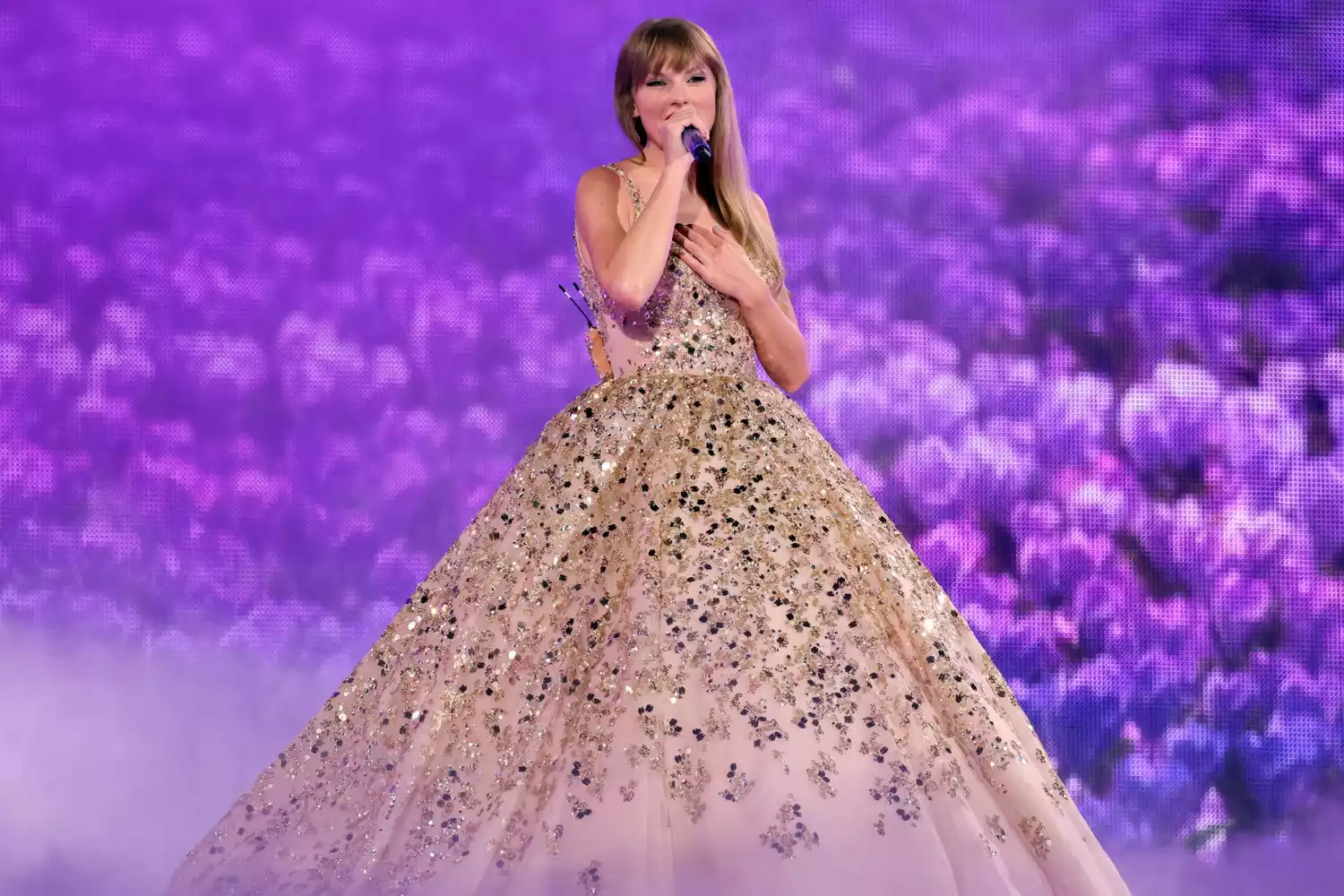 Picture of Taylor rocking a sequined ball gown for her concert