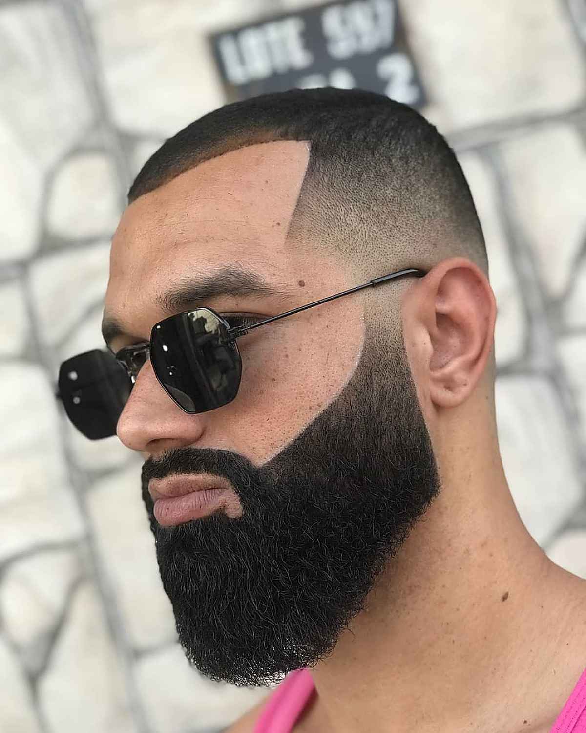 Picture of a man wearing the low fade version of the hairstyle 