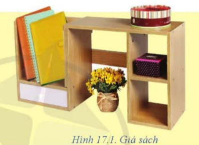 A shelf with books and a flower</p>
<p>Description automatically generated