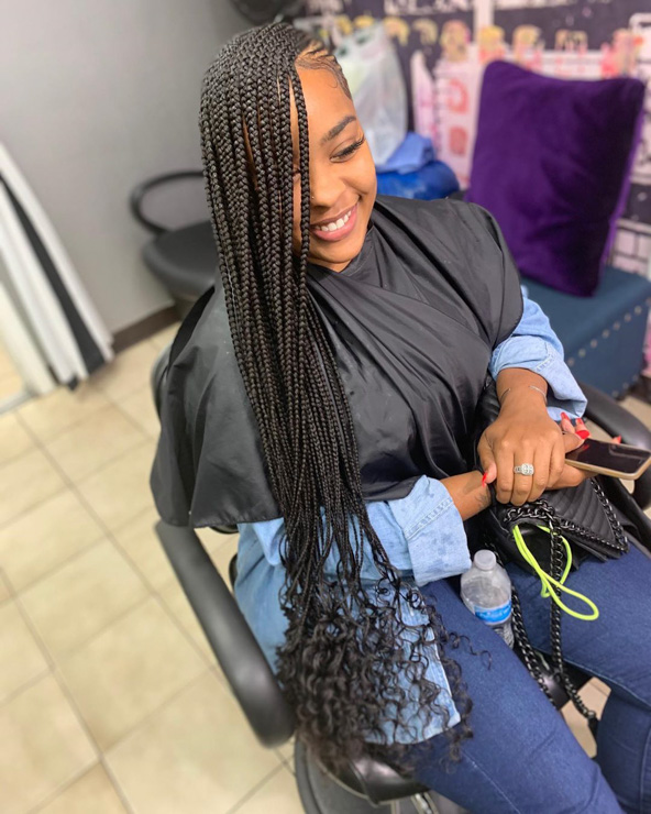 Gorgeous photo of a lady rocking the curly and wavy lemonade braids