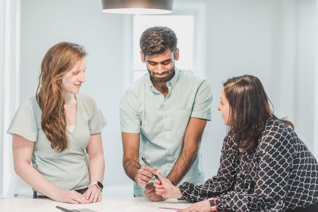 3 people talking to prevent claim denial