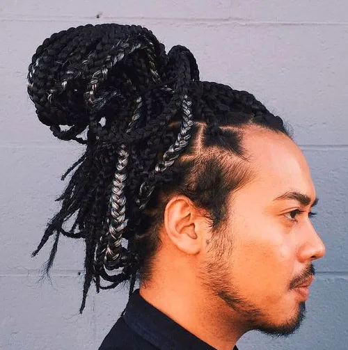 Picture showing a guy rocking braided extensions