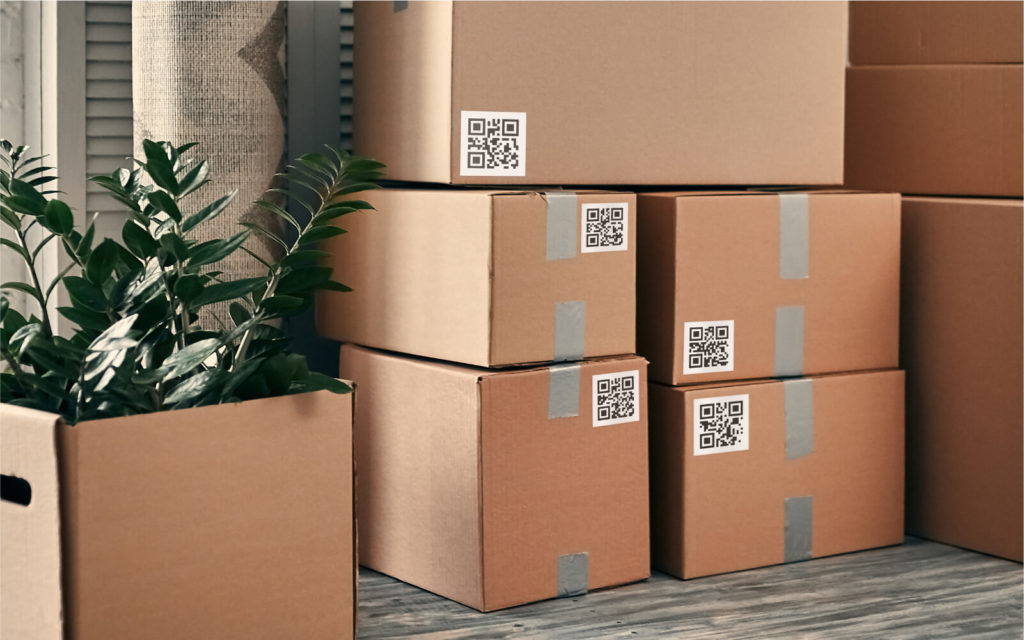 Stack of organized boxes with QR Codes as labels