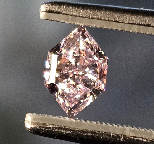 0.74 carat fancy purplish pink diamond