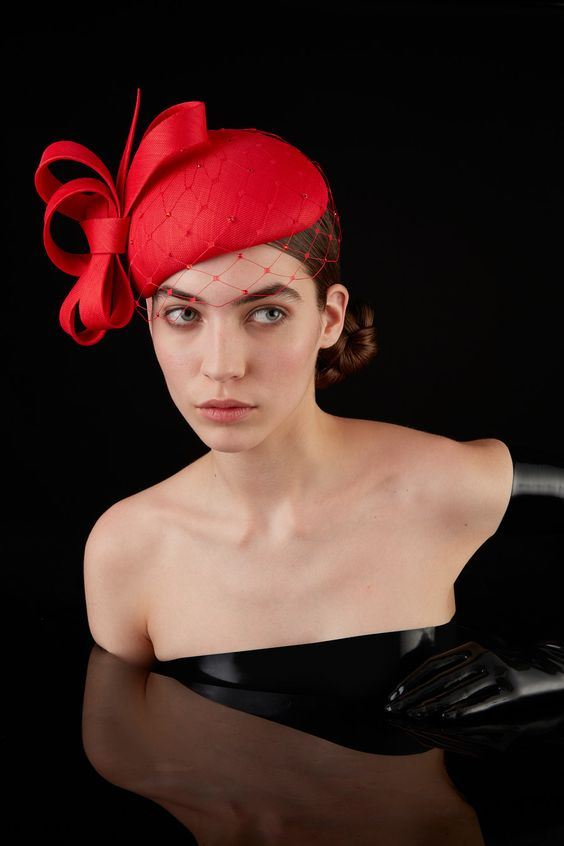 Picture of a lady rocking  the red headpiece with a strapless dress