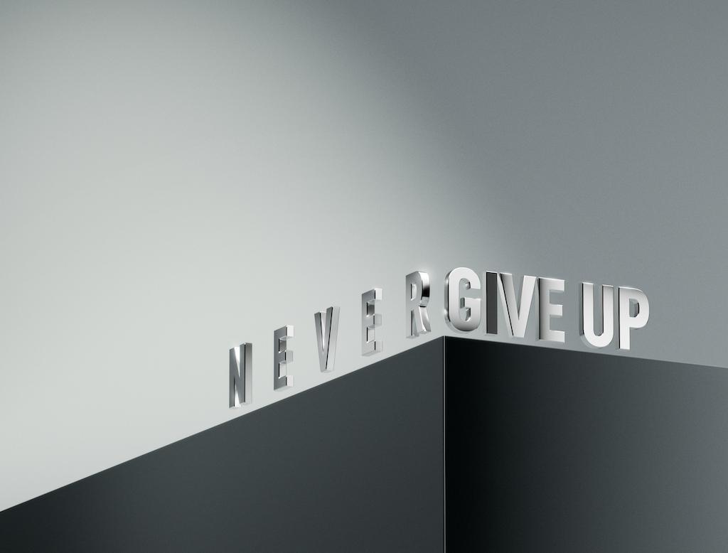 A 3d image saying never give up.
