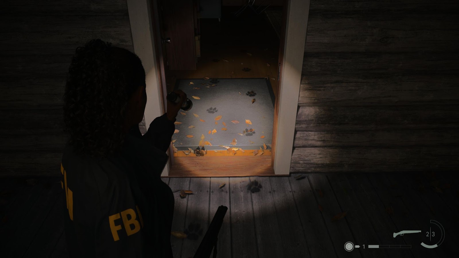 An in game screenshot of the shadow pawprints from the game Alan Wake II. 