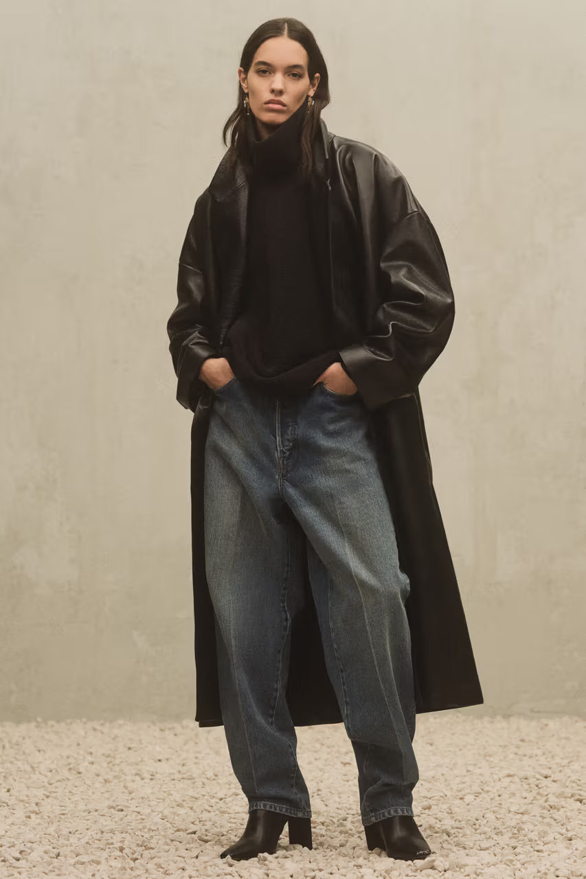 Milan Fashion Week Men’s FW24: Picture of a model posing at the  fashion show  with a black leather coat and jean