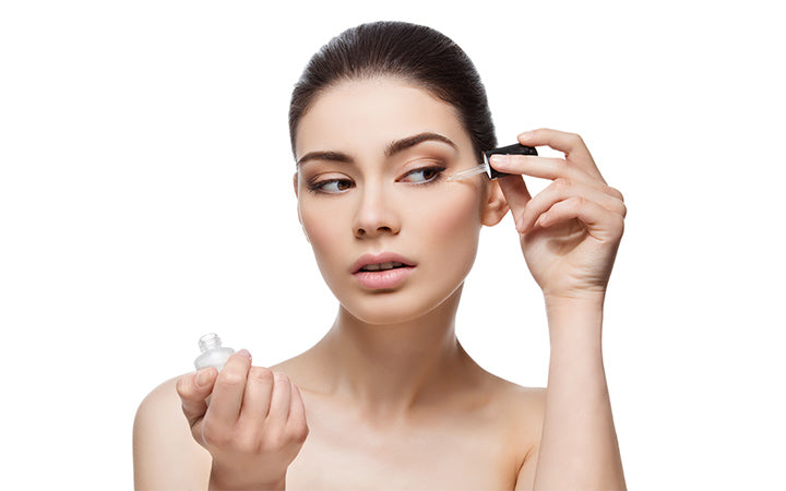 Girl applying serum