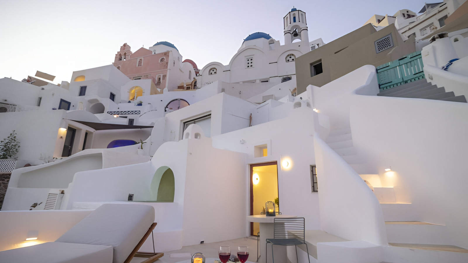 A low-angle shot of the white-washed houses in Santorini. 