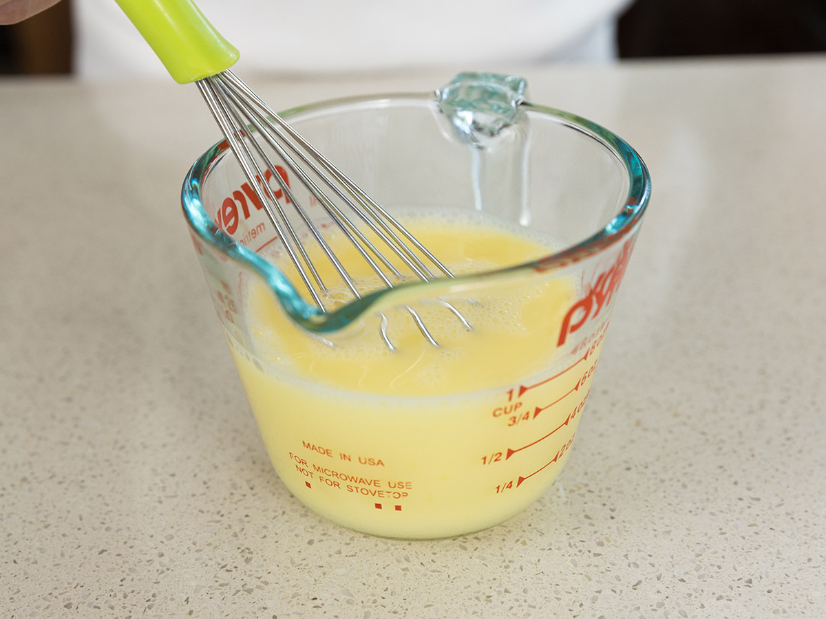 Mixing the egg and ice cold water.