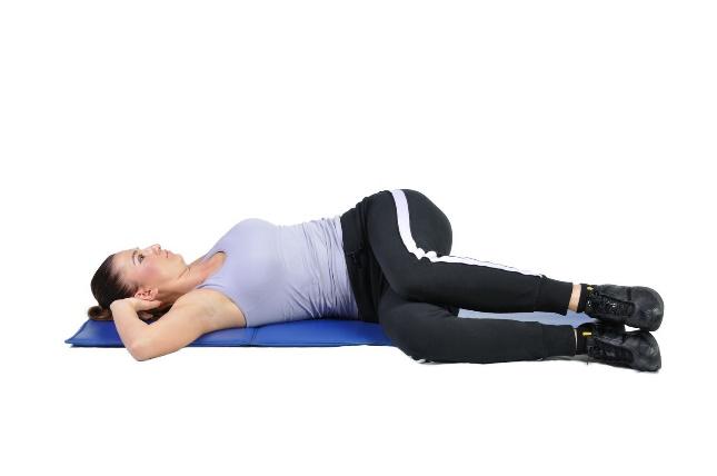 A Yoga Spinal Twist May Help Relieve Back Pain