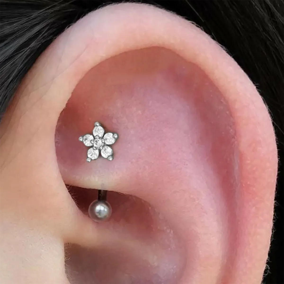 Full picture of the ear lobe wearing the ring