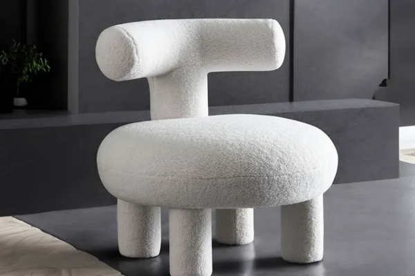 A medium-firm, white accent chair made of microfibre-fleece material.