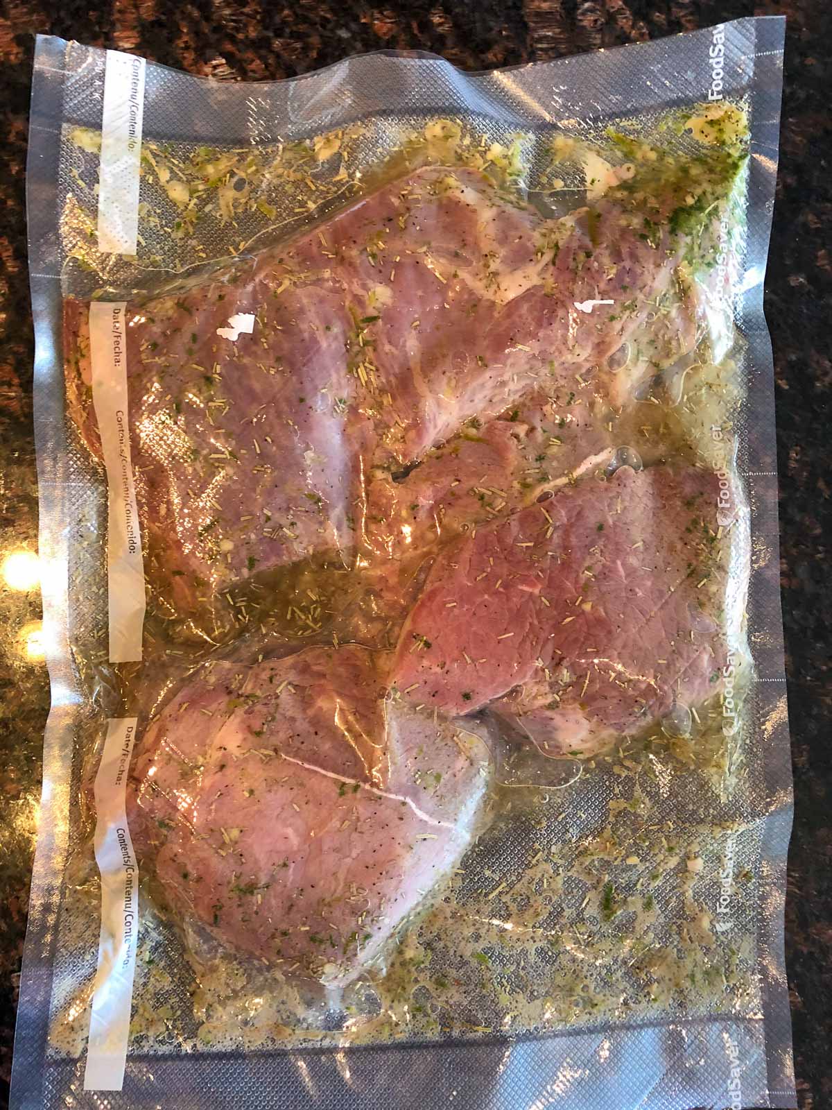 steak marinating in a vacuum packed bag