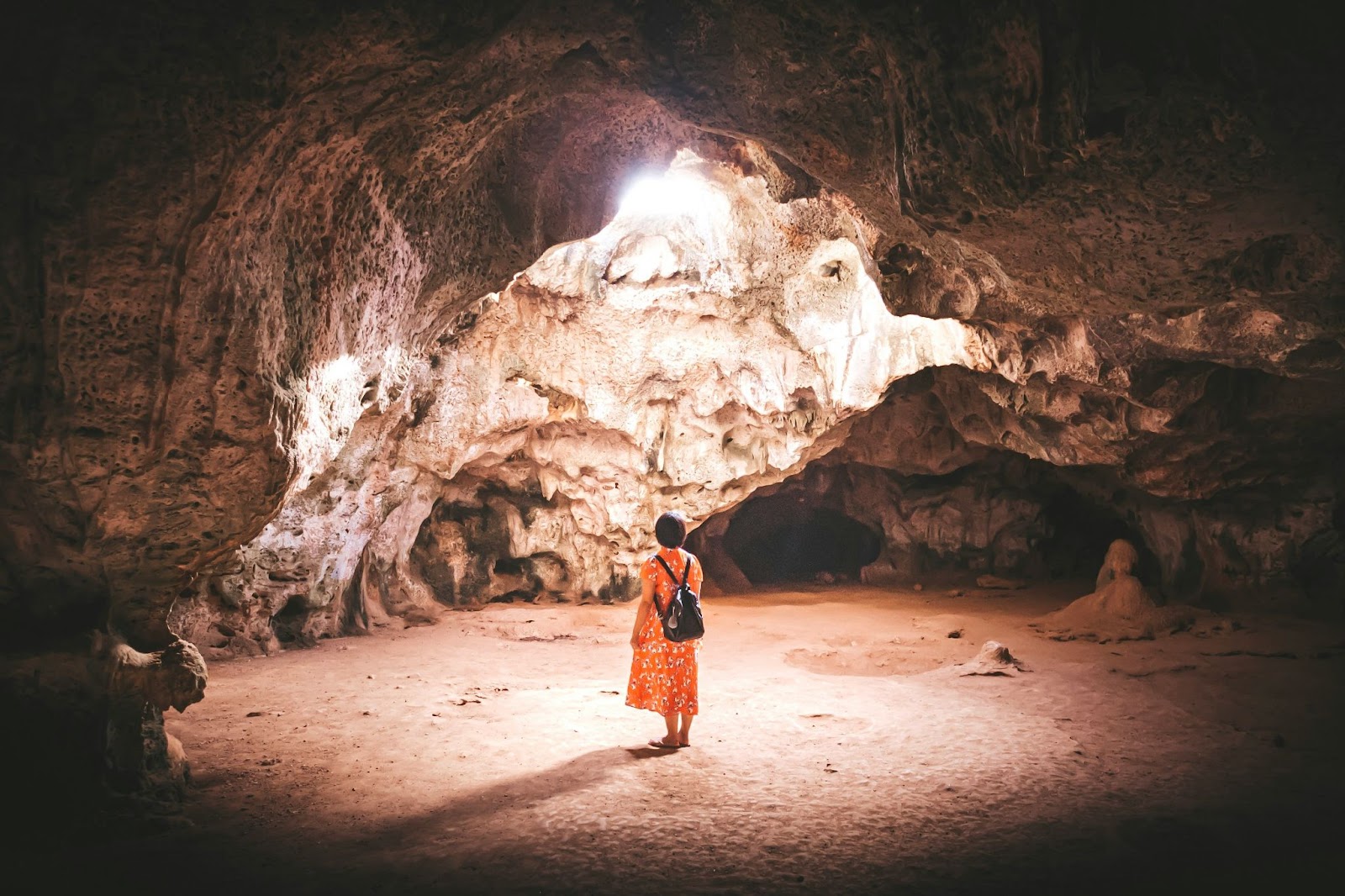 A visitor exploring the cave.