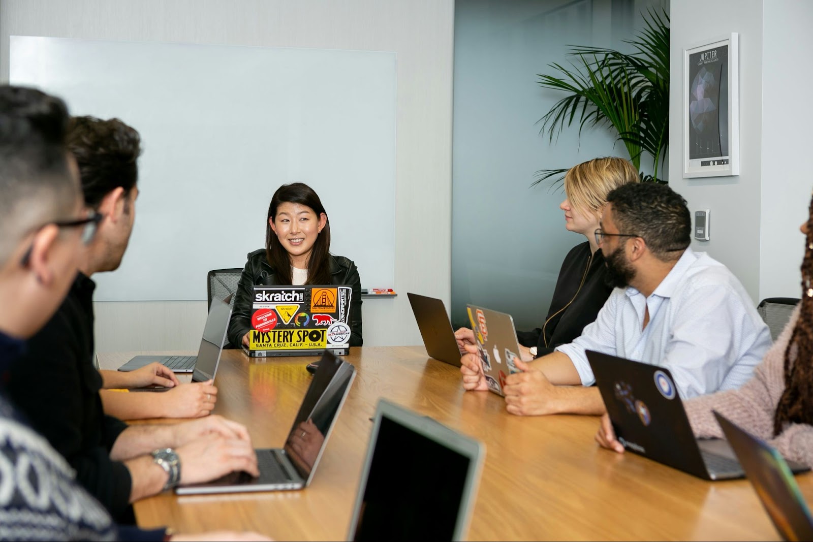 Diverse colleagues in a board room (Racial bias in hiring blog)