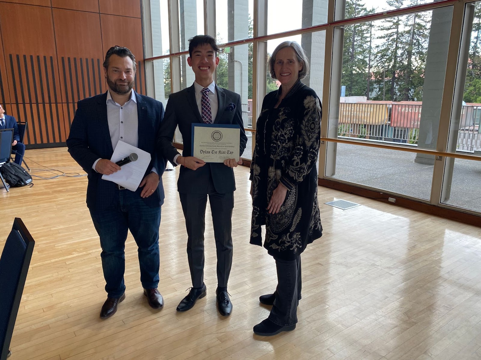 Chair Joan Walker (far right) and CEE Professor Dimitrios Konstantinidis (far left) present Dylan Tay with the Charles G. Hyde Memorial Fund Fellowship. (Photo Credit: Erin Leigh Inama).