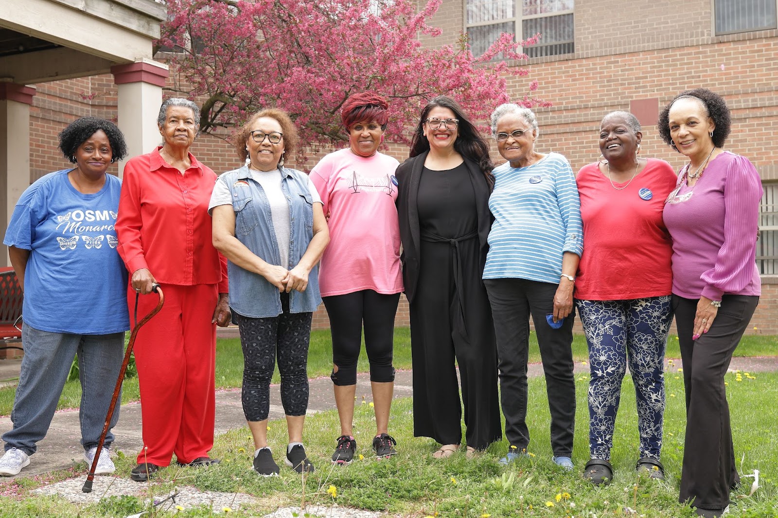 Rashida poses with a group of seniors