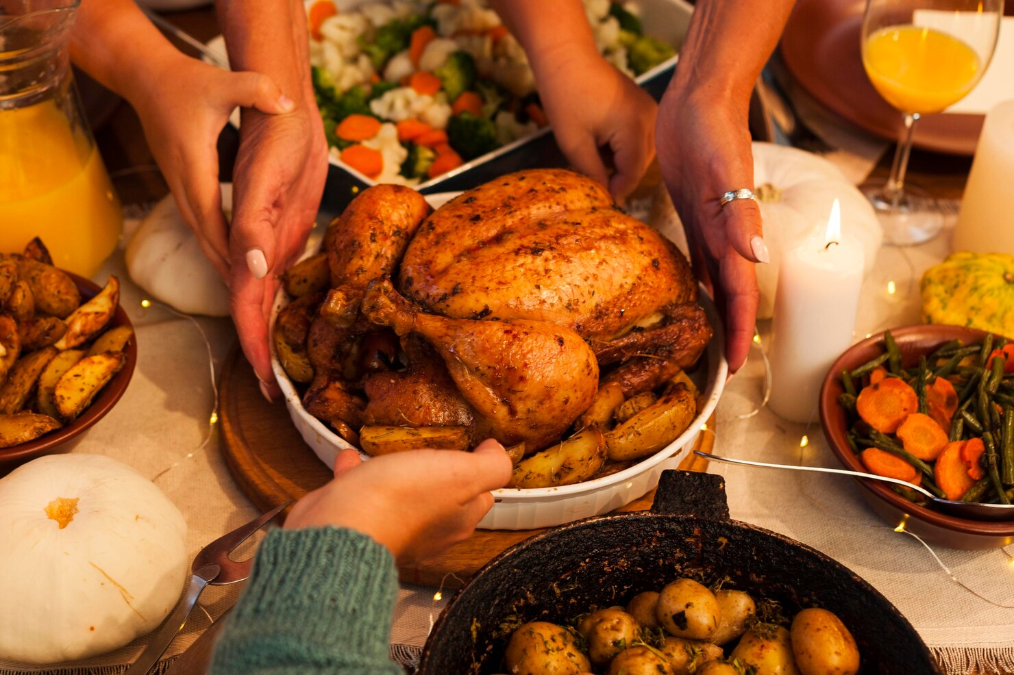 Friends enjoying a hearty feast during Friendsgiving.