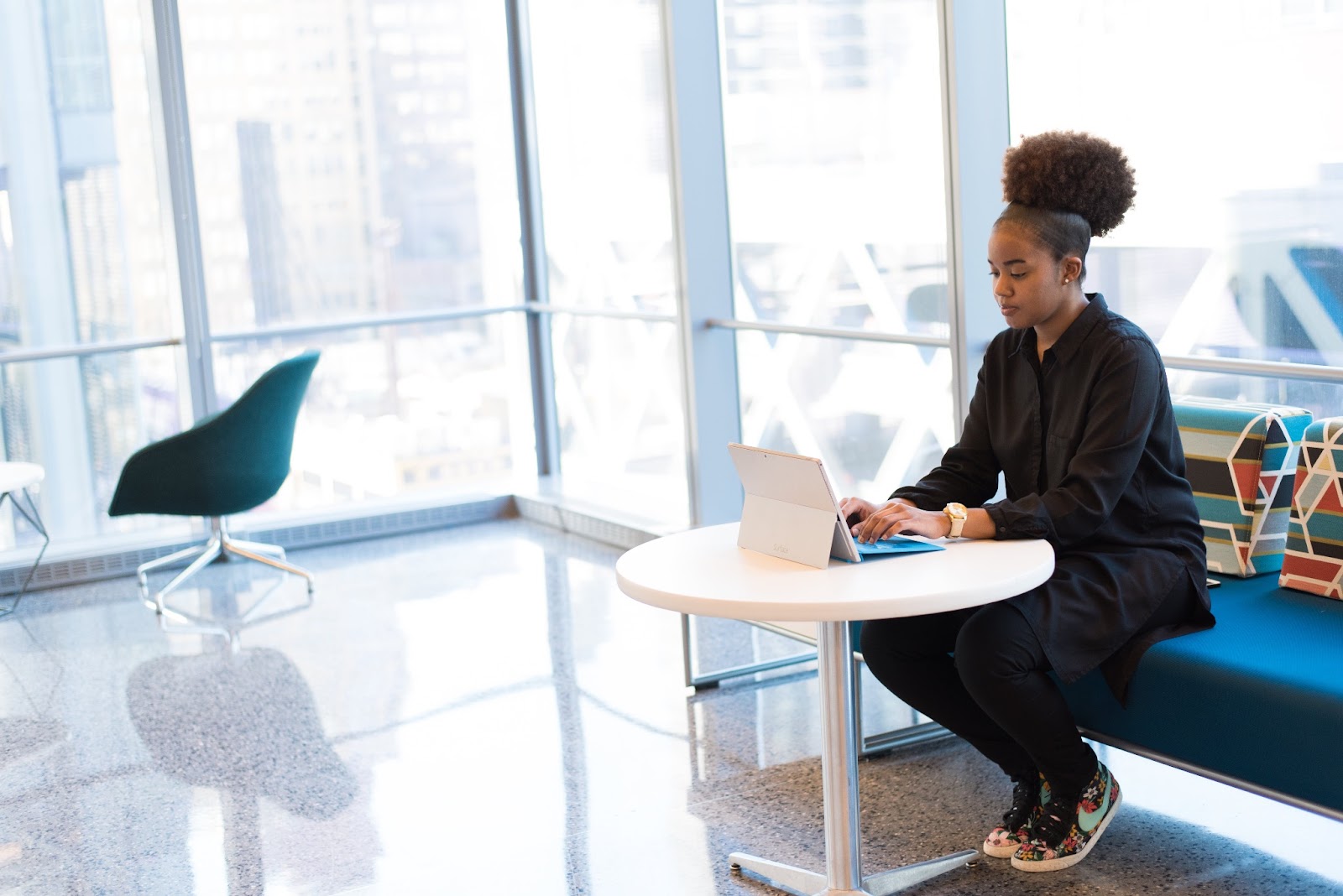 A woman sitting at a desk researching strategy 