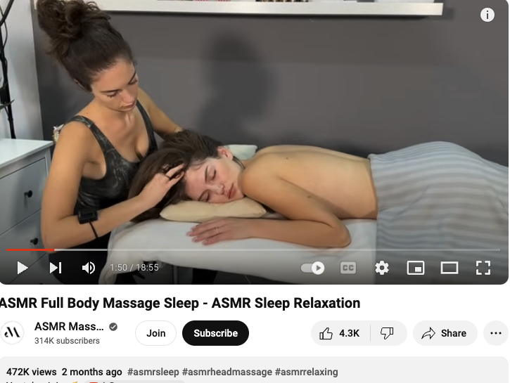  Screenshot of an ASMR video where one attractive woman gives another attractive woman a massage. Apparently it’s to help you go to sleep. 