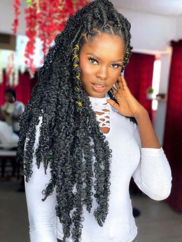 Picture showing a lady rocking faux locs