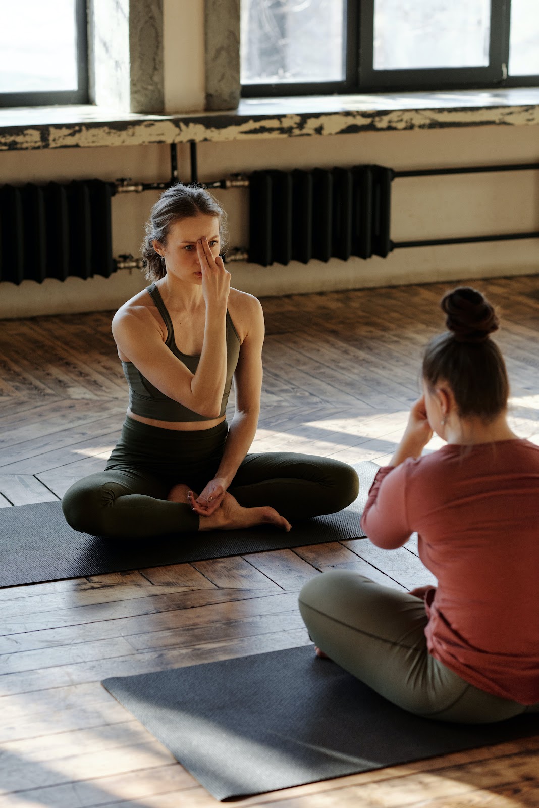 A Calgary personal trainer during a one-on-one yoga session