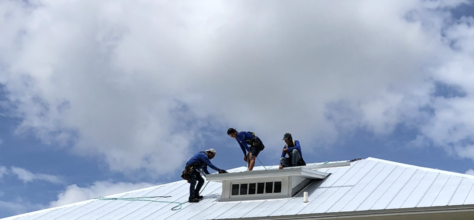 roof workers installing hurricane proof roof