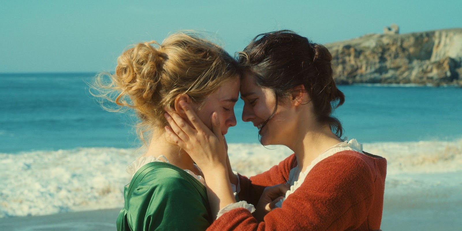 Noémie Merlant holding Adèle Haenel's face in her hands and touching foreheads in 'Portrait of a Lady on Fire'