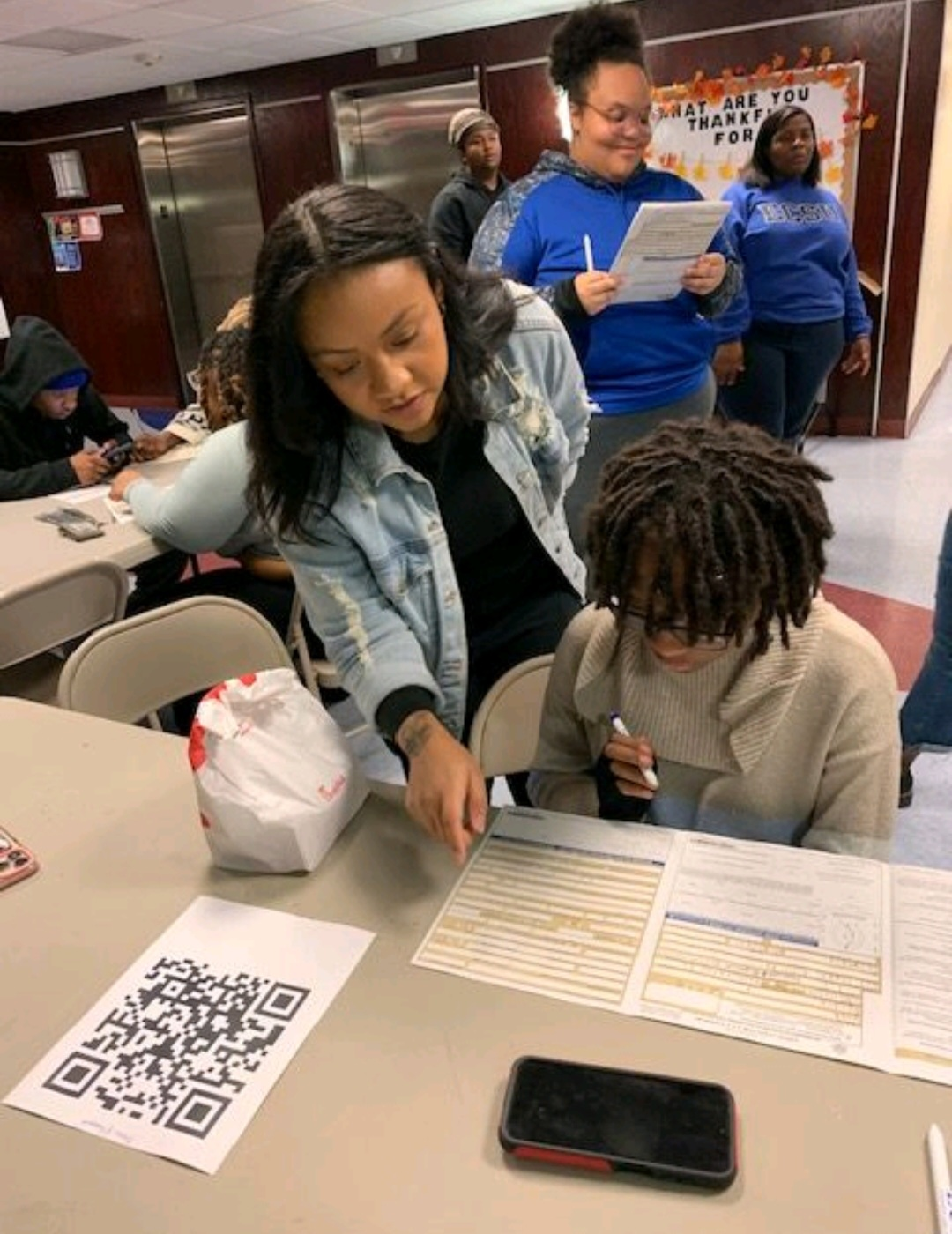 Assisting students to apply for passports on campus.