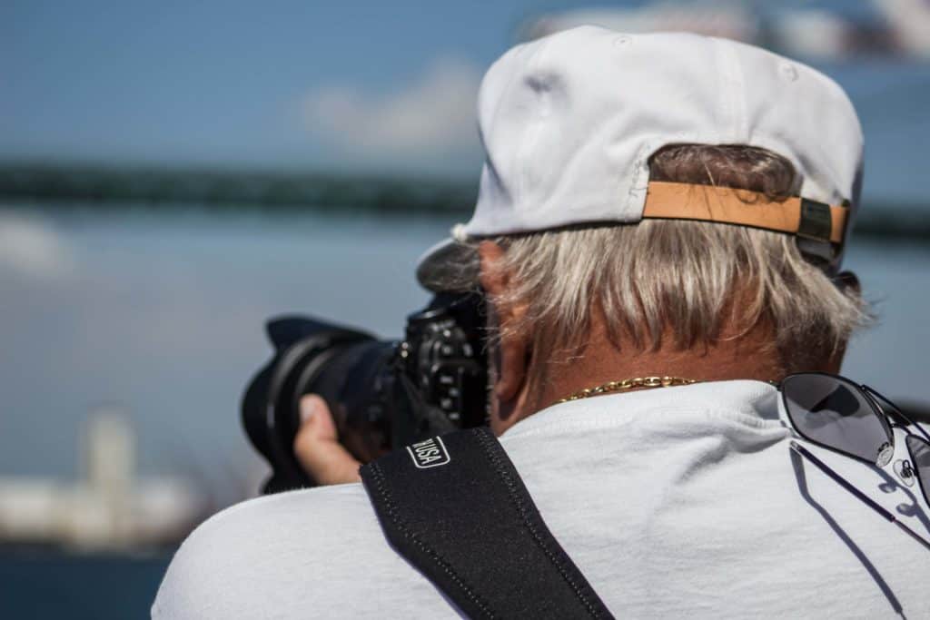 senior retiree working as a professional photographer