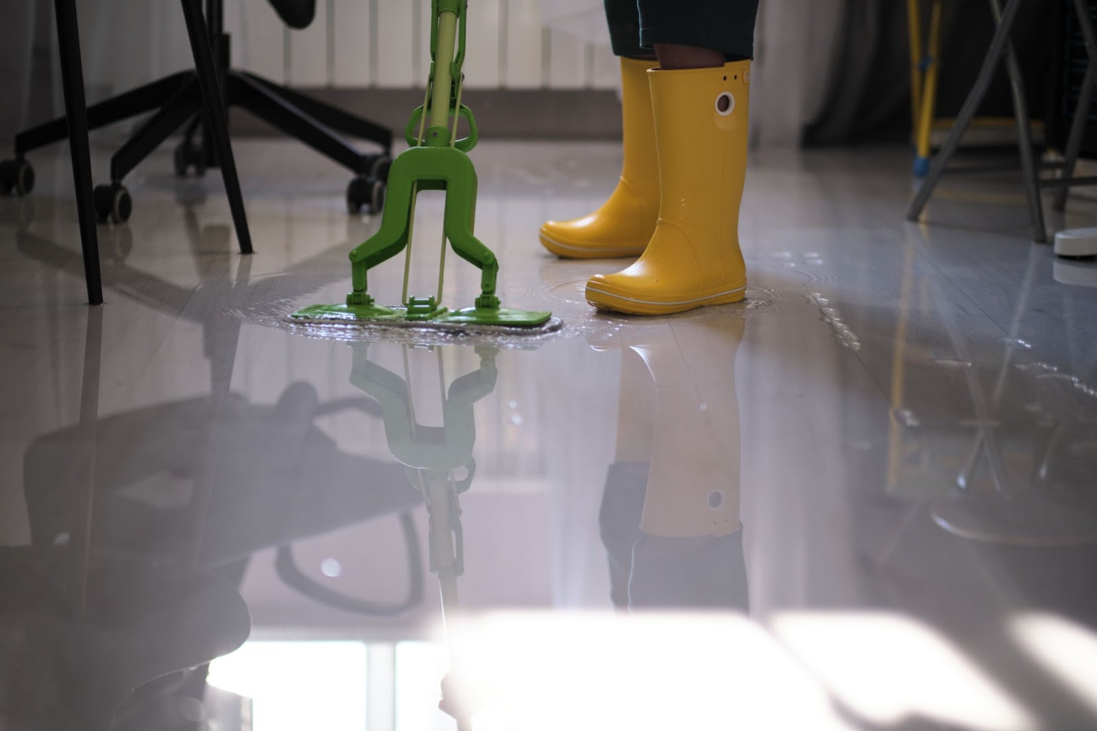 rain boots standing in house flooded with water