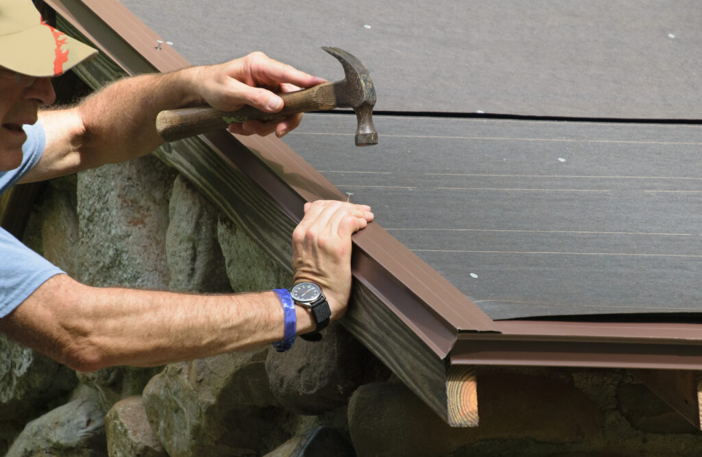 What Is Roof Flashing - Installing a drip edge over roof felt on a new roof