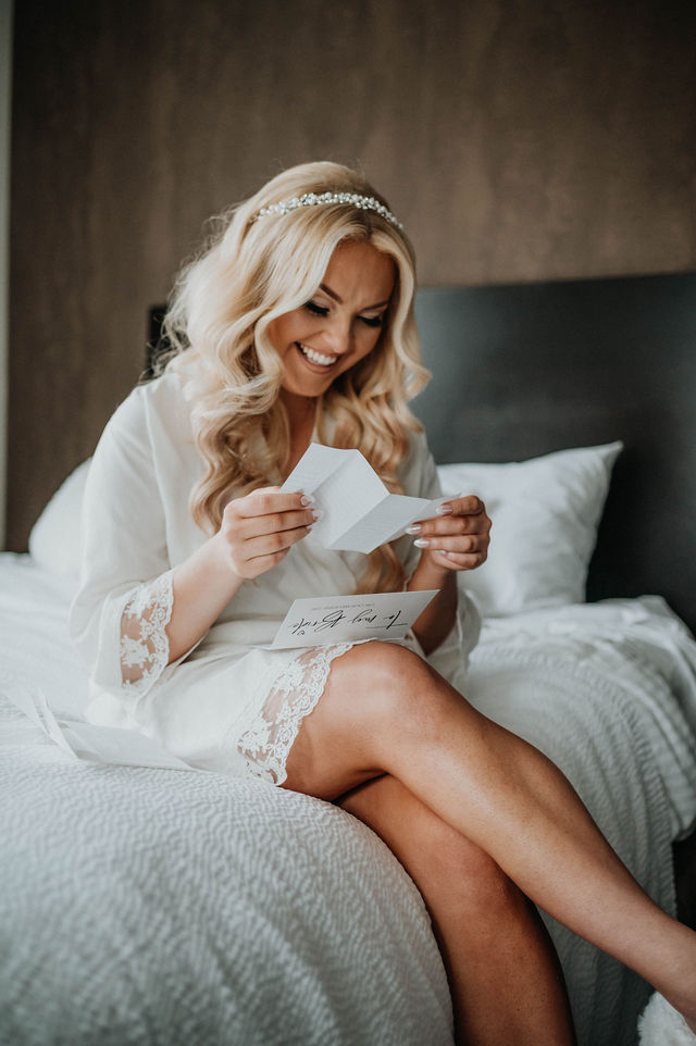 Bride reading a letter given to her as a wedding day gift.