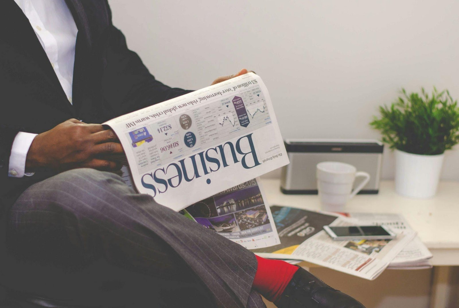Professional reading about the latest accounting trends in a business publication.