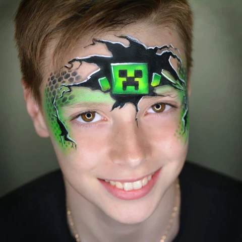 Picture of a young boy rocking the minecraft face paint idea