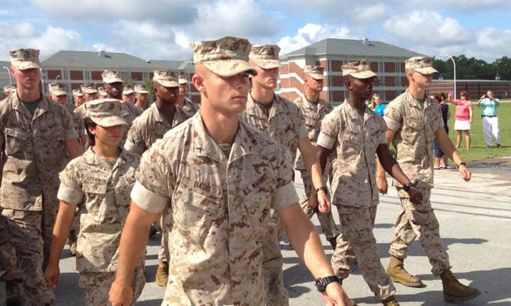 Christopher Daud walks in uniform in formation