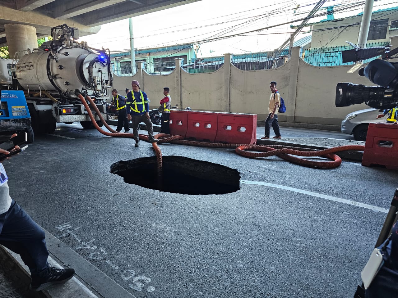 Sinkhole spotted along Sales Road near the Villamor Air Base in Pasay City on Sunday afternoon, April 14, 2024. 