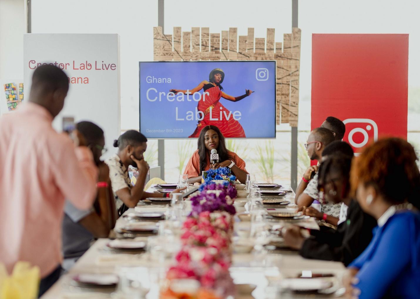 A group of people sitting at a long table Description automatically generated