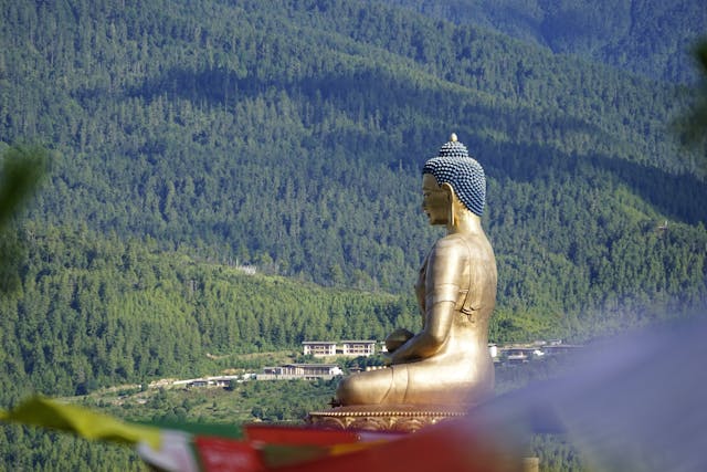 Buddha Dordenma, a massive statue of Buddha, towers over Thimphu. Sacred monasteries and temples of Bhutan are architectural marvels.