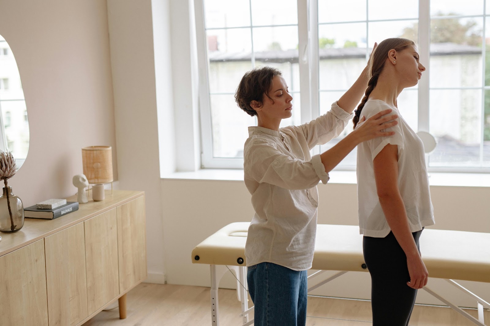 Physical Therapist treating a woman.